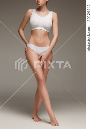 Young, slim, healthy and beautiful woman in white Young, slim, healthy and beautiful woman in white 29129942