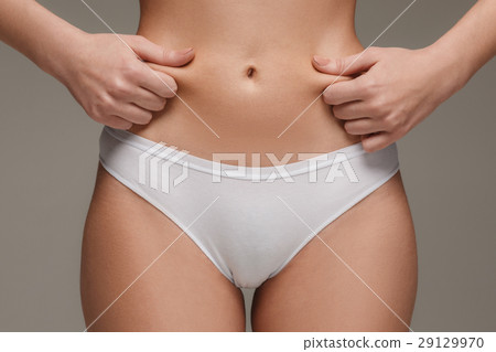 Young, slim, healthy and beautiful woman in white Young, slim, healthy and beautiful woman in white 29129970