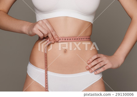 The girl taking measurements of her body, white 29130006