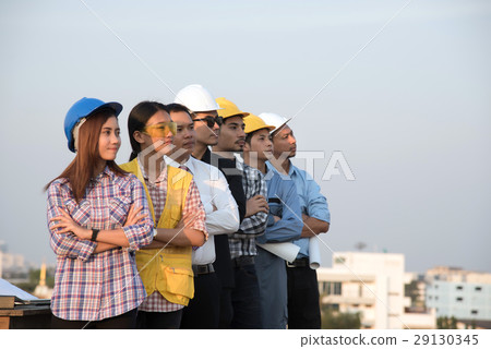 Group of engineers and architects standing Group of engineers and architects standing 29130345