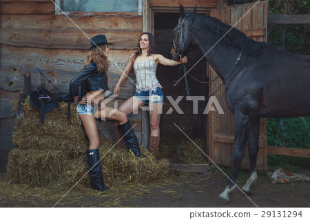 Stylish women cowboys. 29131294