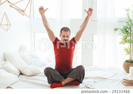 Guy raised his hands up and meditates. Guy raised his hands up and meditates. 29131488