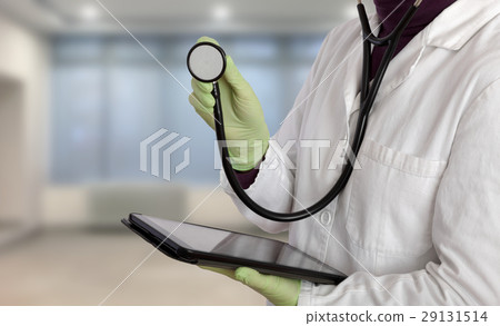 Doctor using tablet and sthetoscope in hospital Doctor using tablet and sthetoscope in hospital 29131514