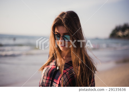 Close up beach portrait of cheerful blonde hipster 29135636