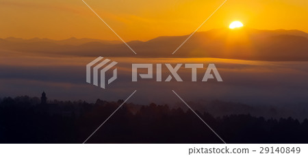 Misty dawn over mountains 29140849