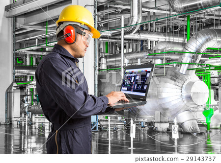 Engineer using computer for maintenance in factory Engineer using computer for maintenance in factory 29143737