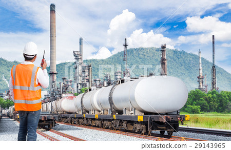 Egineer talking on radio at oil refinery 29143965