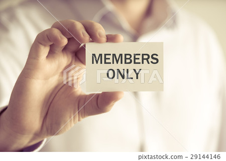 Businessman holding MEMBERS ONLY message card Businessman holding MEMBERS ONLY message card 29144146