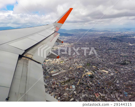 the airplane is taking off over city the airplane is taking off over city 29144315