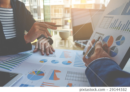 Business people discussing the charts and graphs 29144382