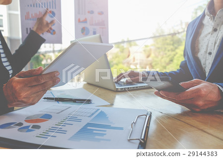 Business people discussing the charts and graphs 29144383