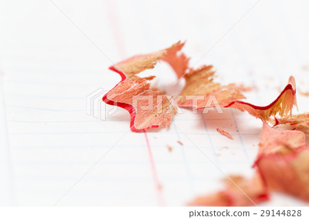 pencil shavings on white paper. close pencil shavings on white paper. close 29144828