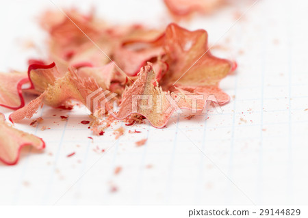 pencil shavings on white paper. close pencil shavings on white paper. close 29144829