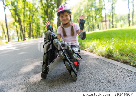 Little girl on roller skates at park Little girl on roller skates at park 29146807
