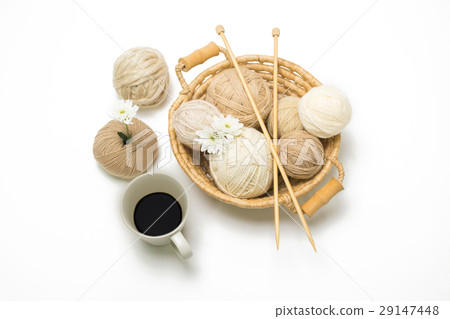 Brown yarns ball in the basket with coffee Brown yarns ball in the basket with coffee 29147448