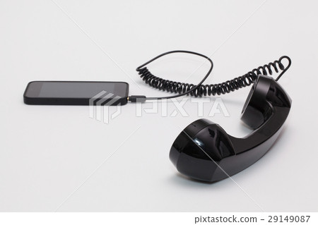 Old phone reciever and new phone. Old phone reciever and new phone. 29149087