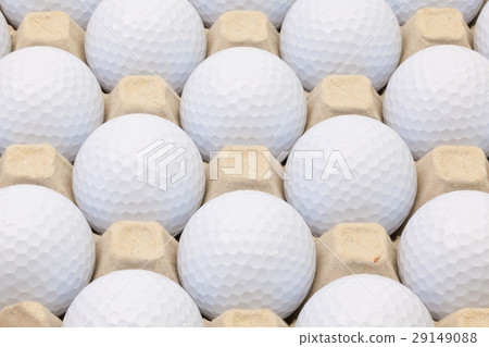 White golf balls in the open box White golf balls in the open box 29149088