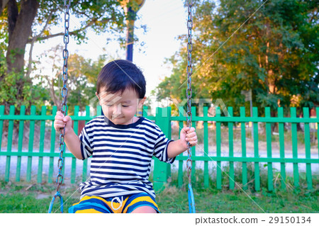 Young Asian boy play a iron swinging at playground 29150134
