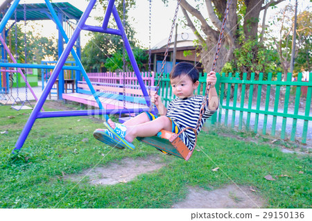 Young Asian boy play a iron swinging at playground 29150136