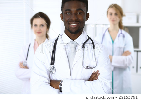 Happy african american male doctor  with medica 29153761