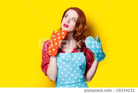 woman with colorful potholders 29154232