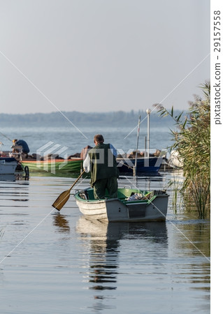 Fisher on your boat on the lake Balaton Fisher on your boat on the lake Balaton 29157558