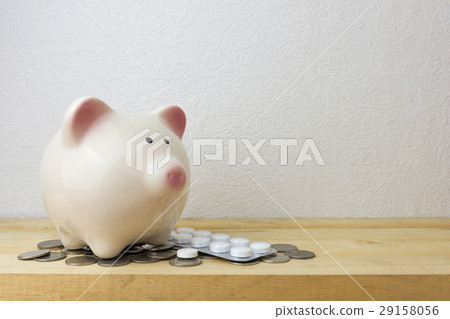 piggy bank with medicine and coins piggy bank with medicine and coins 29158056