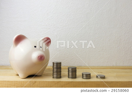 Piggybank and money tower Piggybank and money tower 29158060