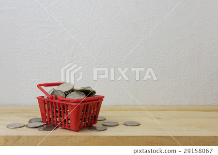 coins in a basket red for money concept 29158067