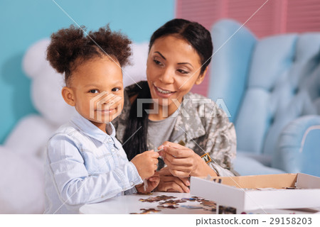 Sweet child and her mom enjoying every moment 29158203