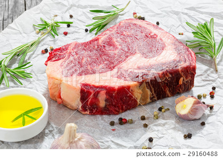 raw beef rib eye fresh meat steak on white paper 29160488