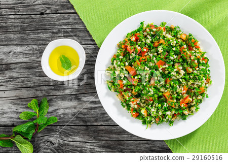 parsley salad or Tabbouleh on white platter 29160516