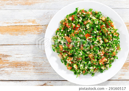 parsley salad or Tabbouleh on white platter 29160517