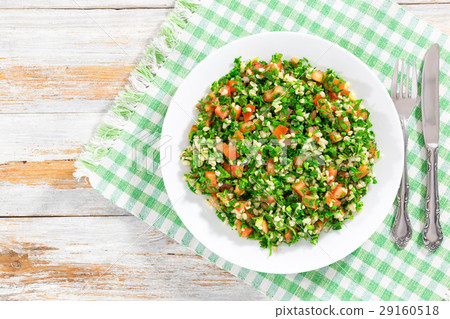 parsley salad or Tabbouleh on white platter 29160518