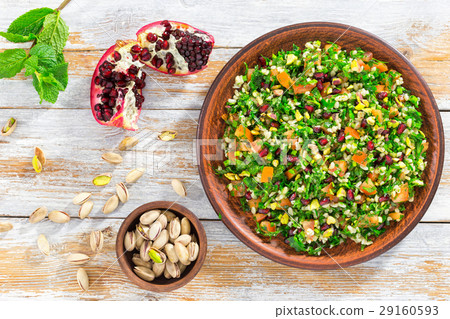 tabbouleh salad with pomegranate, pistachio nuts 29160593