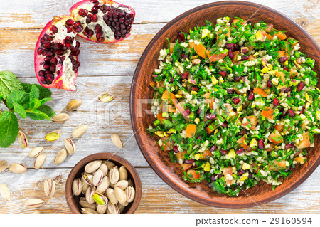 tabbouleh salad with pomegranate, pistachio nuts 29160594