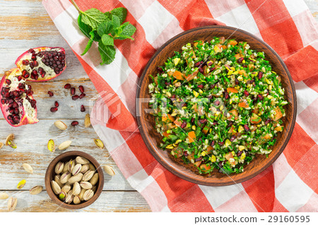 tabbouleh salad with pomegranate and pistachio 29160595