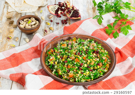 tabbouleh salad with pomegranate, pistachio 29160597