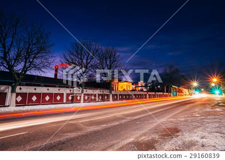 Night city avenue in the background of the factory 29160839