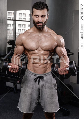 Handsome fitness model train in gym gain muscle Handsome fitness model train in gym gain muscle 29161312