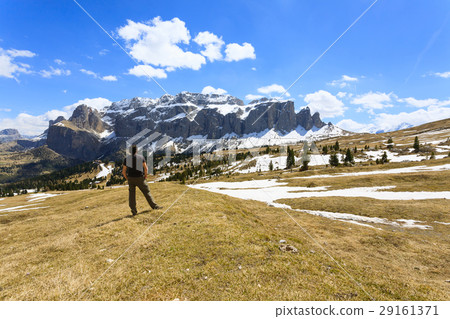 Man on top of mountain looking at the horizon. Man on top of mountain looking at the horizon. 29161371