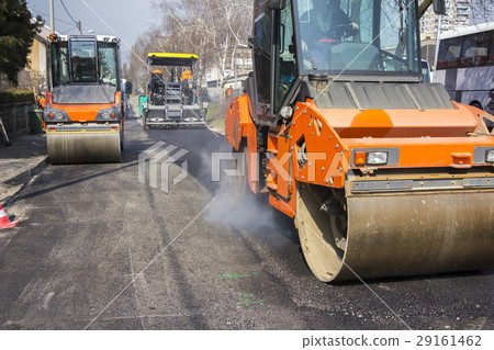 Road roller compacting asphalt 29161462
