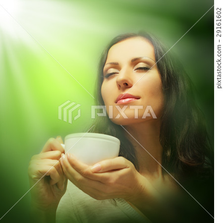 Beautiful woman drinking green tea Beautiful woman drinking green tea 29161602
