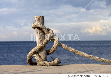 Rope on seafront and cloudy sky in sun autumn day Rope on seafront and cloudy sky in sun autumn day 29161697