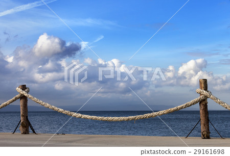 Seafront and sky with sunlight clouds in autumn Seafront and sky with sunlight clouds in autumn 29161698
