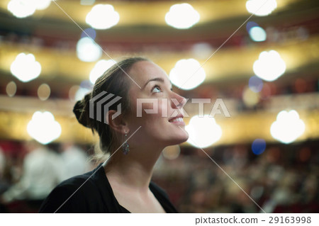 Woman in auditorium of teatre 29163998