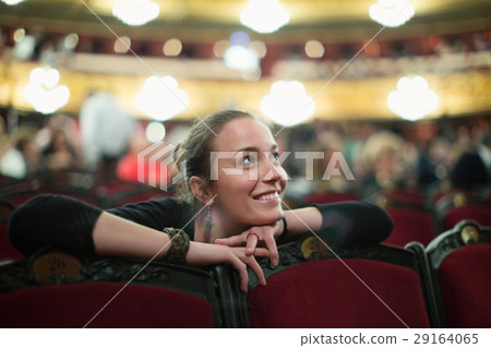 Woman in auditorium of teatre Woman in auditorium of teatre 29164065