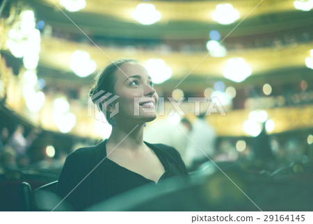 Girl in auditorium of teatre 29164145