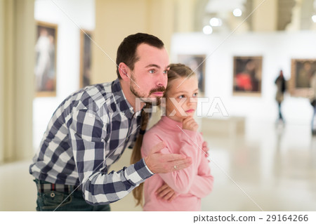 concentrated father and daughter exploring expositions in museum concentrated father and daughter exploring expositions in museum 29164266
