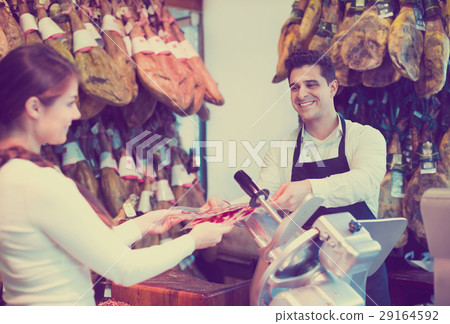 Female customer buying Spanish jamon 29164592